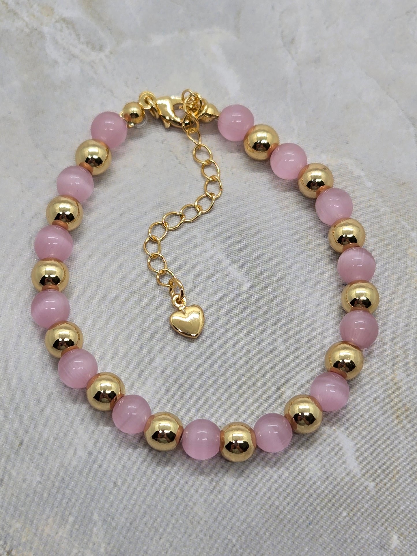 Pink Glass and gold plated beads