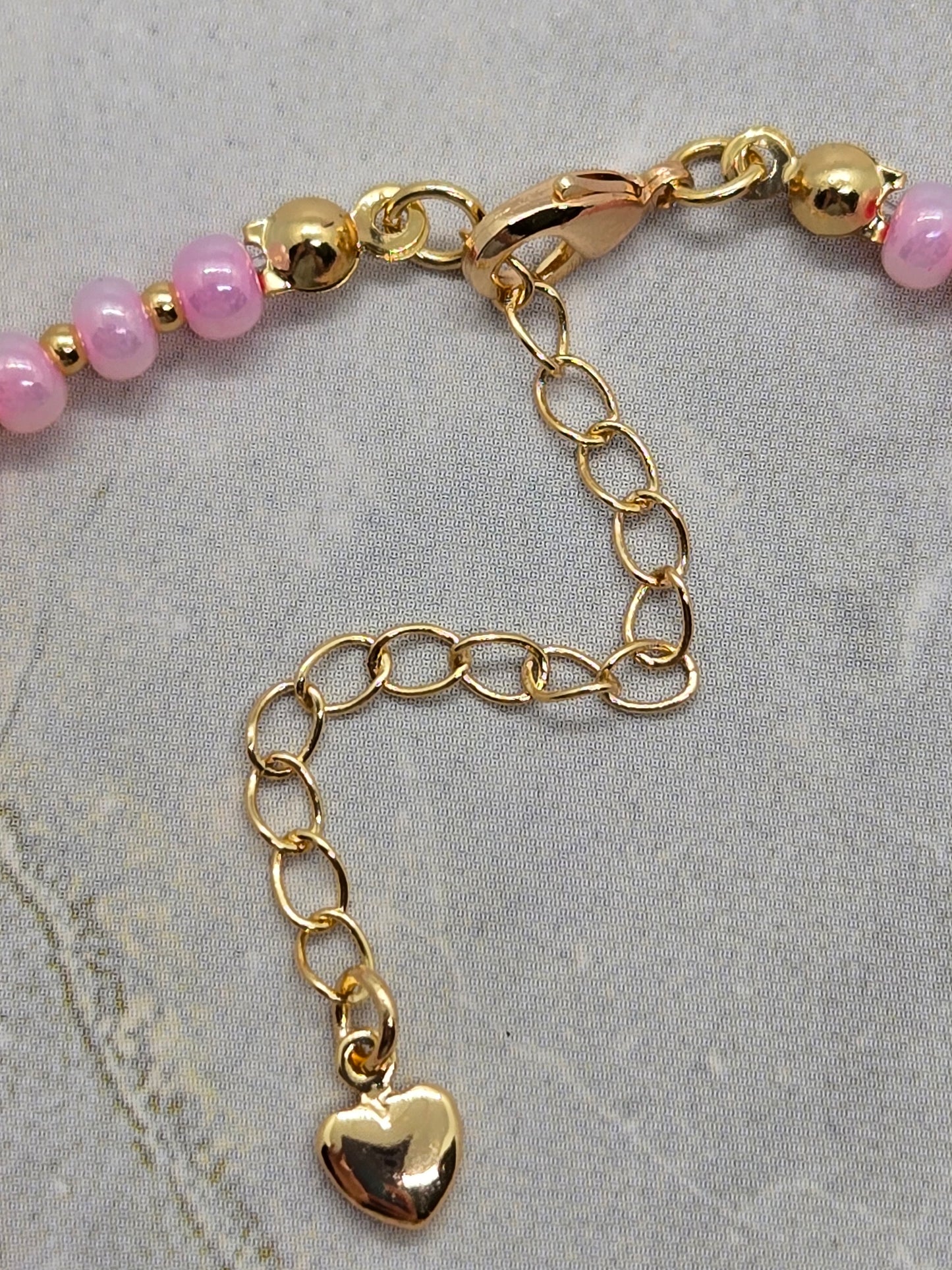 Pink Glass and gold heart plated beads