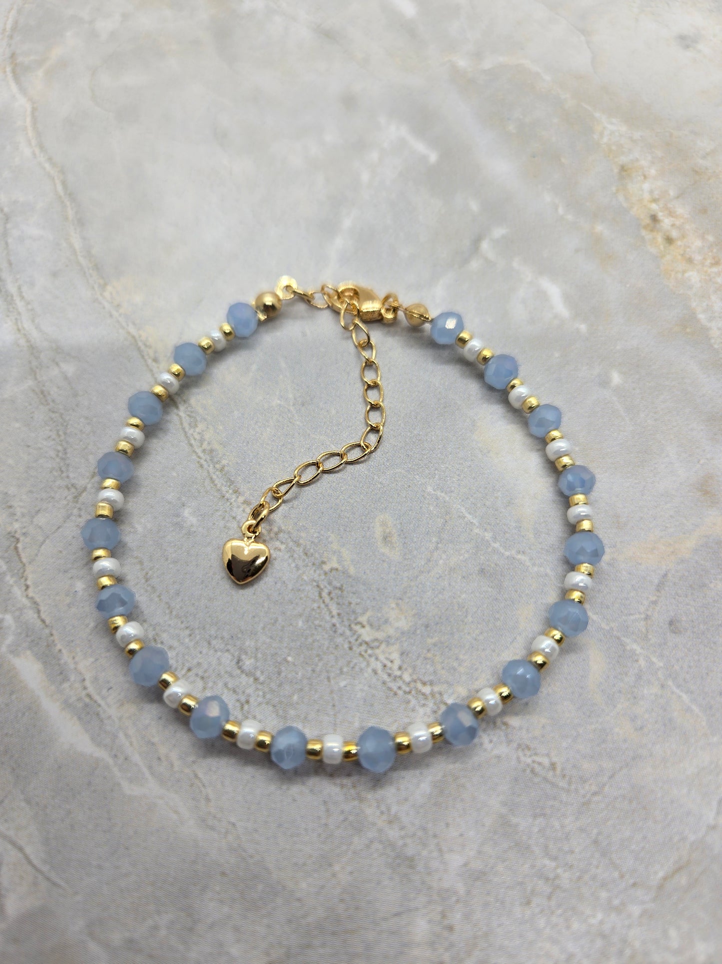 Light blue, white and gold plated beads bracelet