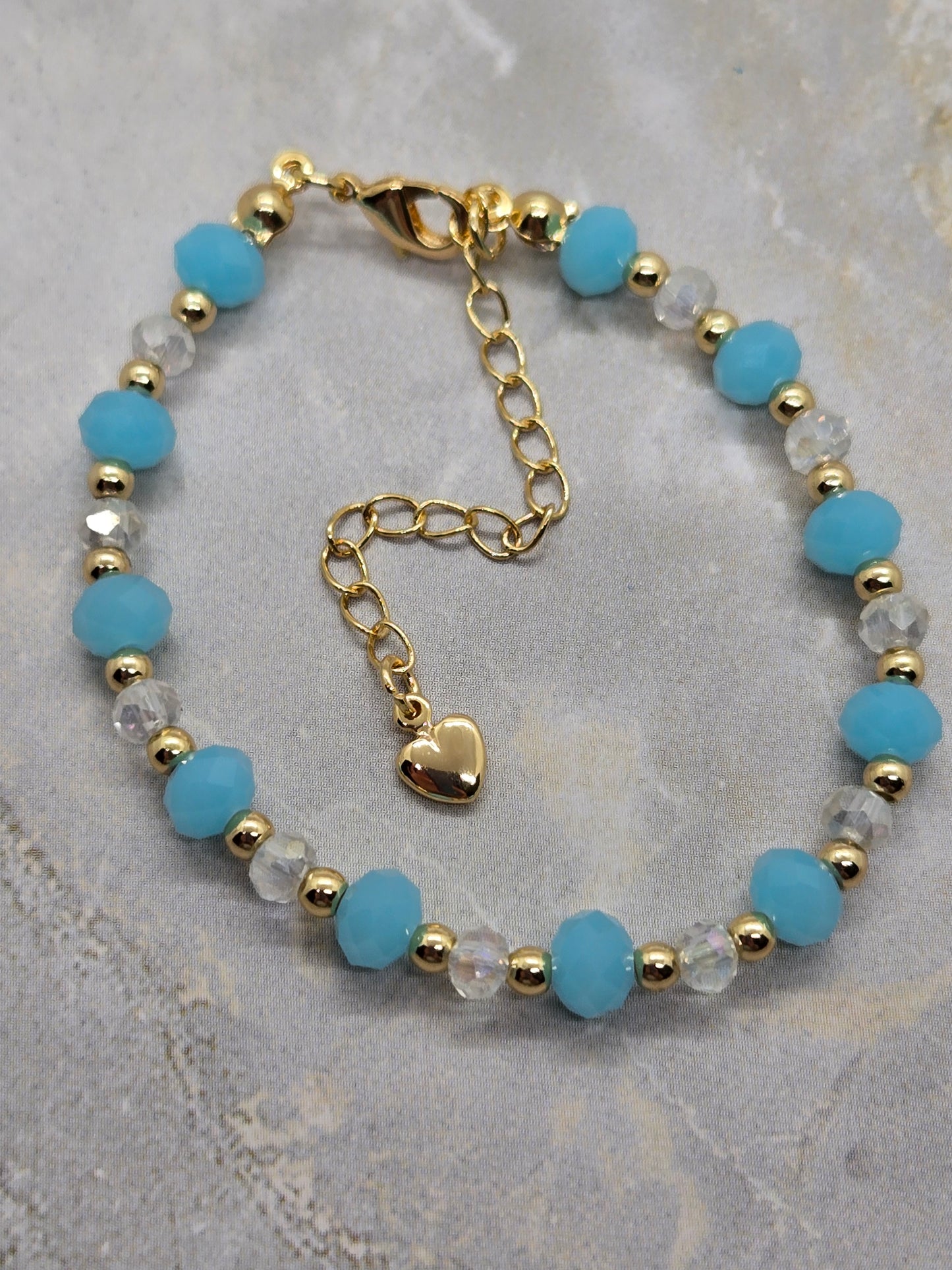 Light blue and gold plated beads bracelet