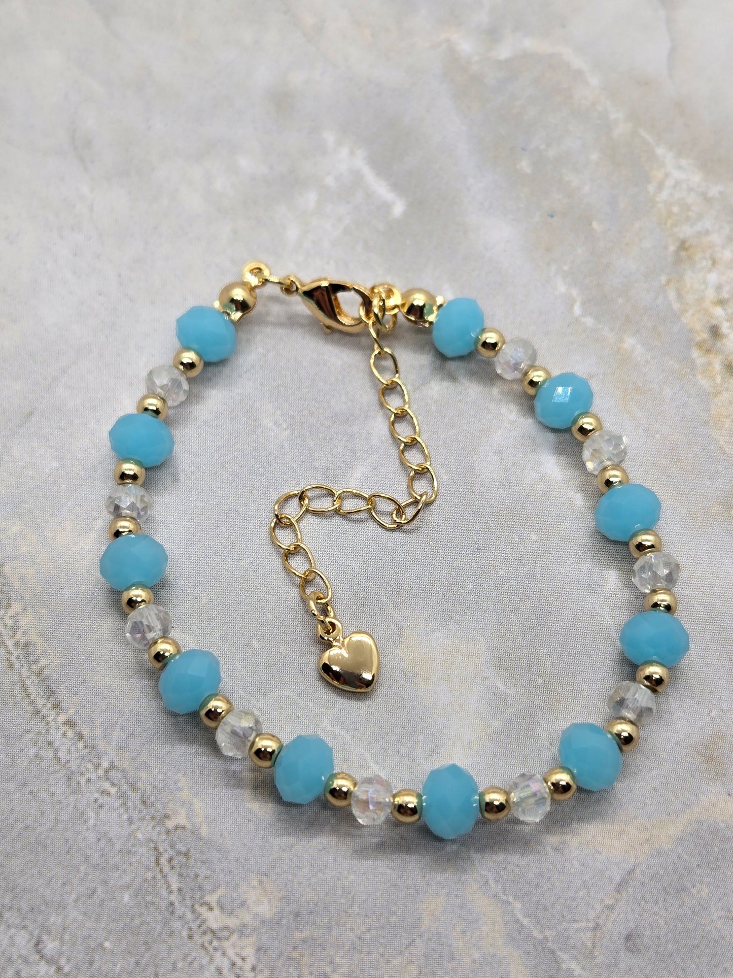 Light blue and gold plated beads bracelet