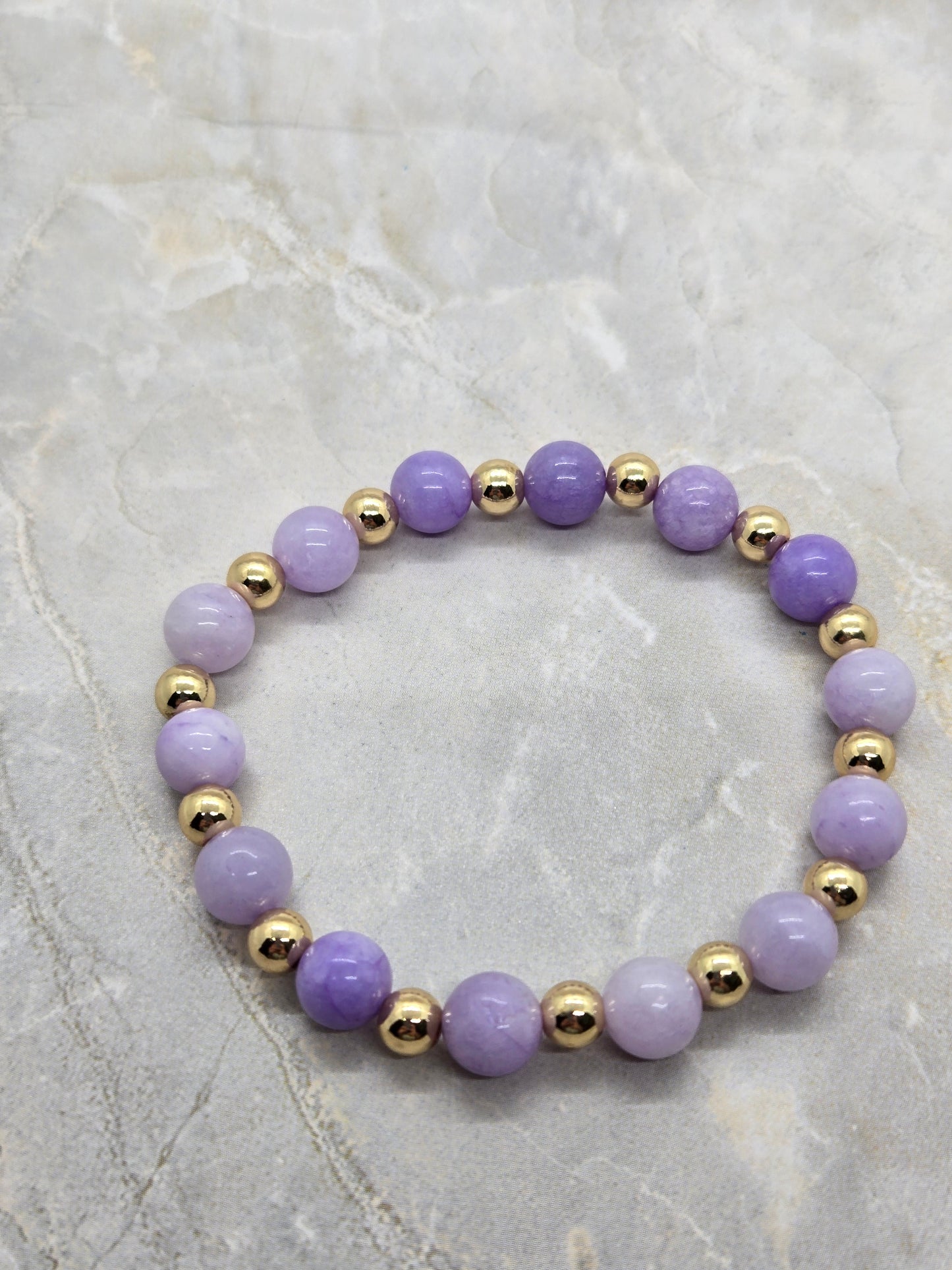 Purple and gold elastic bracelet