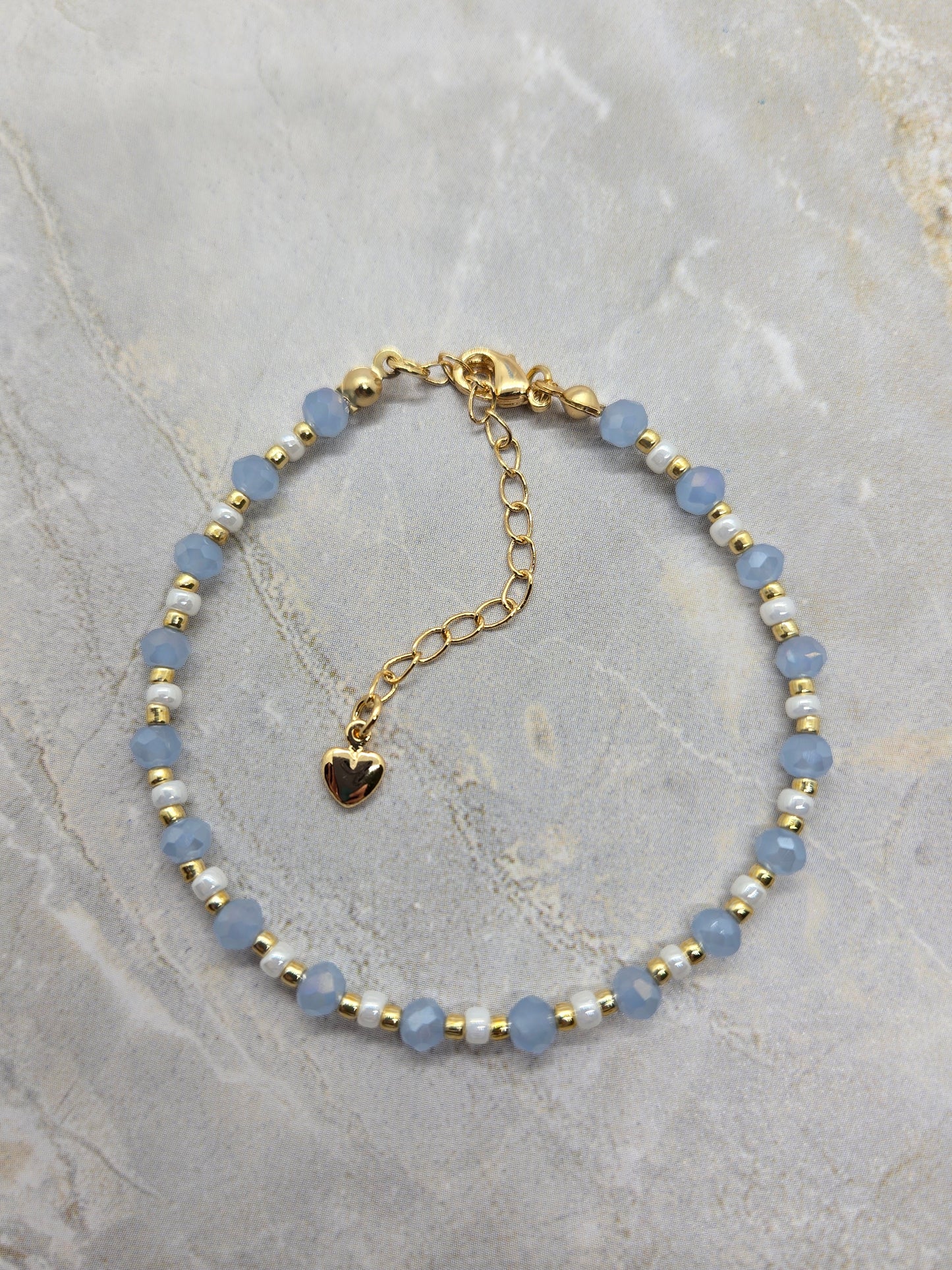 Light blue, white  and gold plated beads bracelet