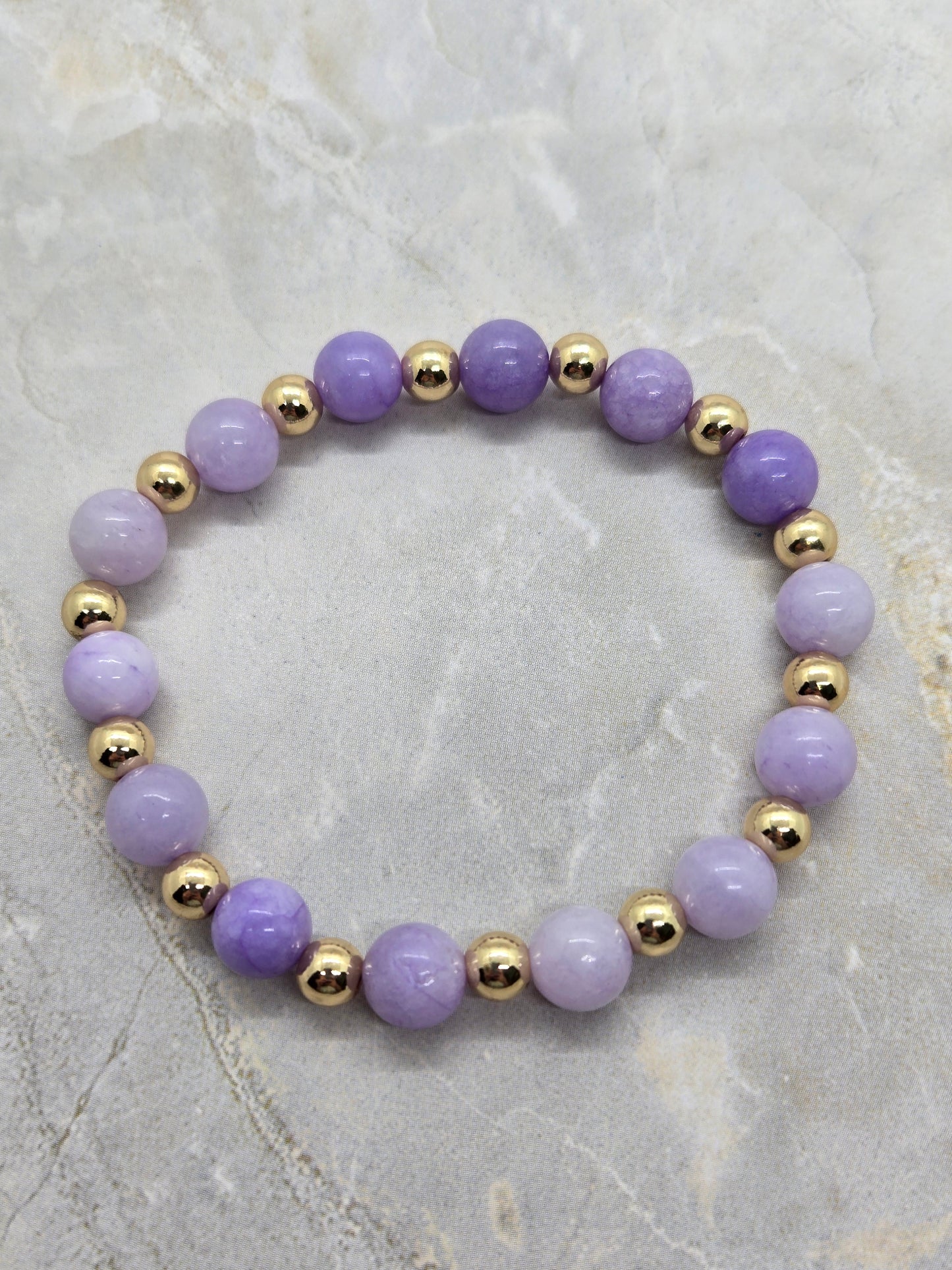 Purple and gold elastic bracelet