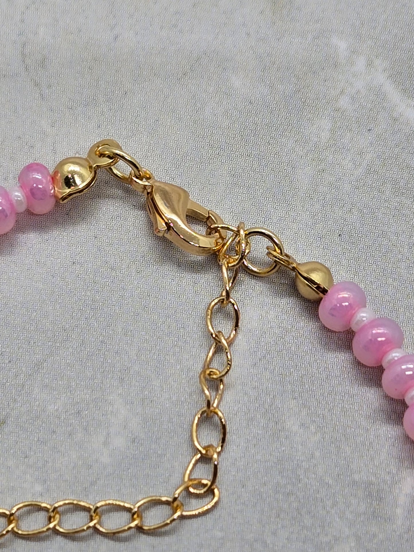 Pink and white bracelet