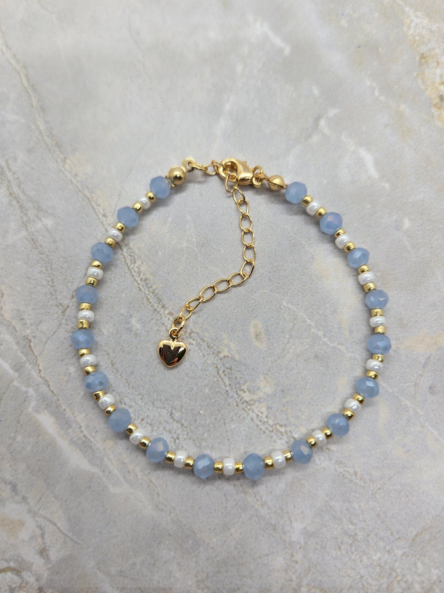 Light blue, white  and gold plated beads bracelet