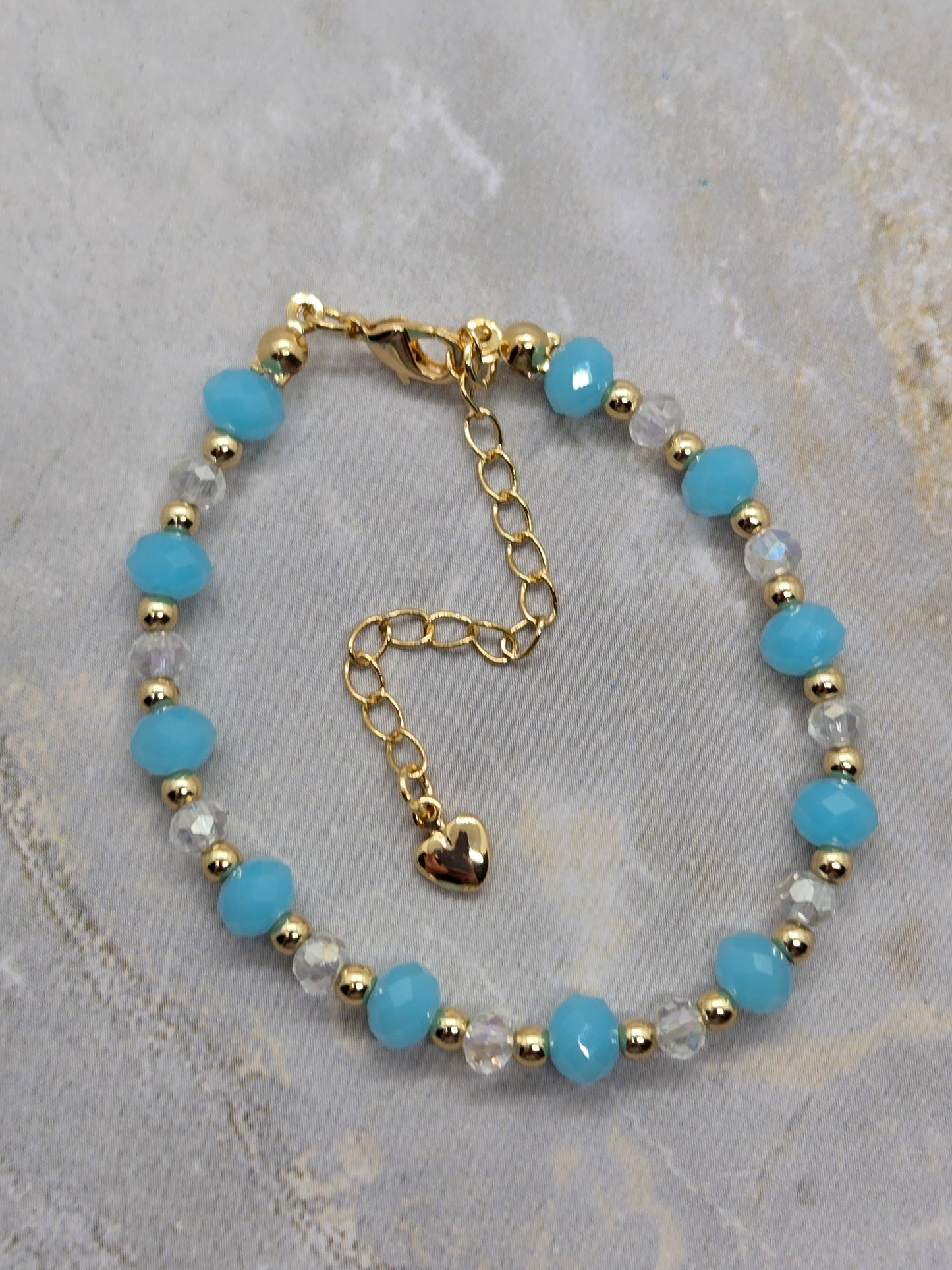 Light blue and gold plated beads bracelet
