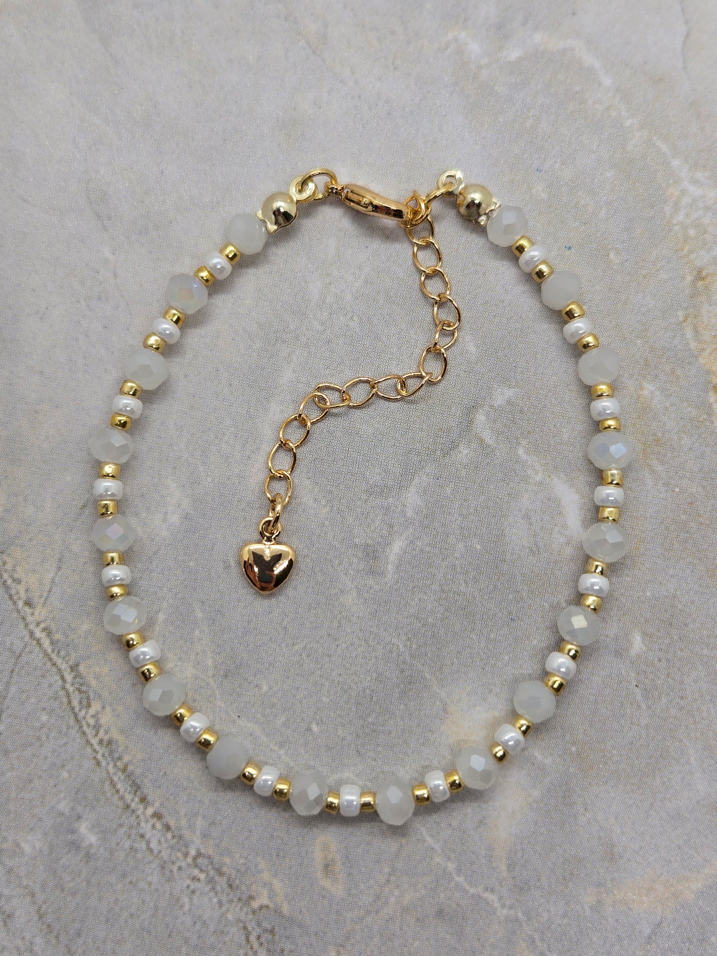 White and gold plated beads bracelet