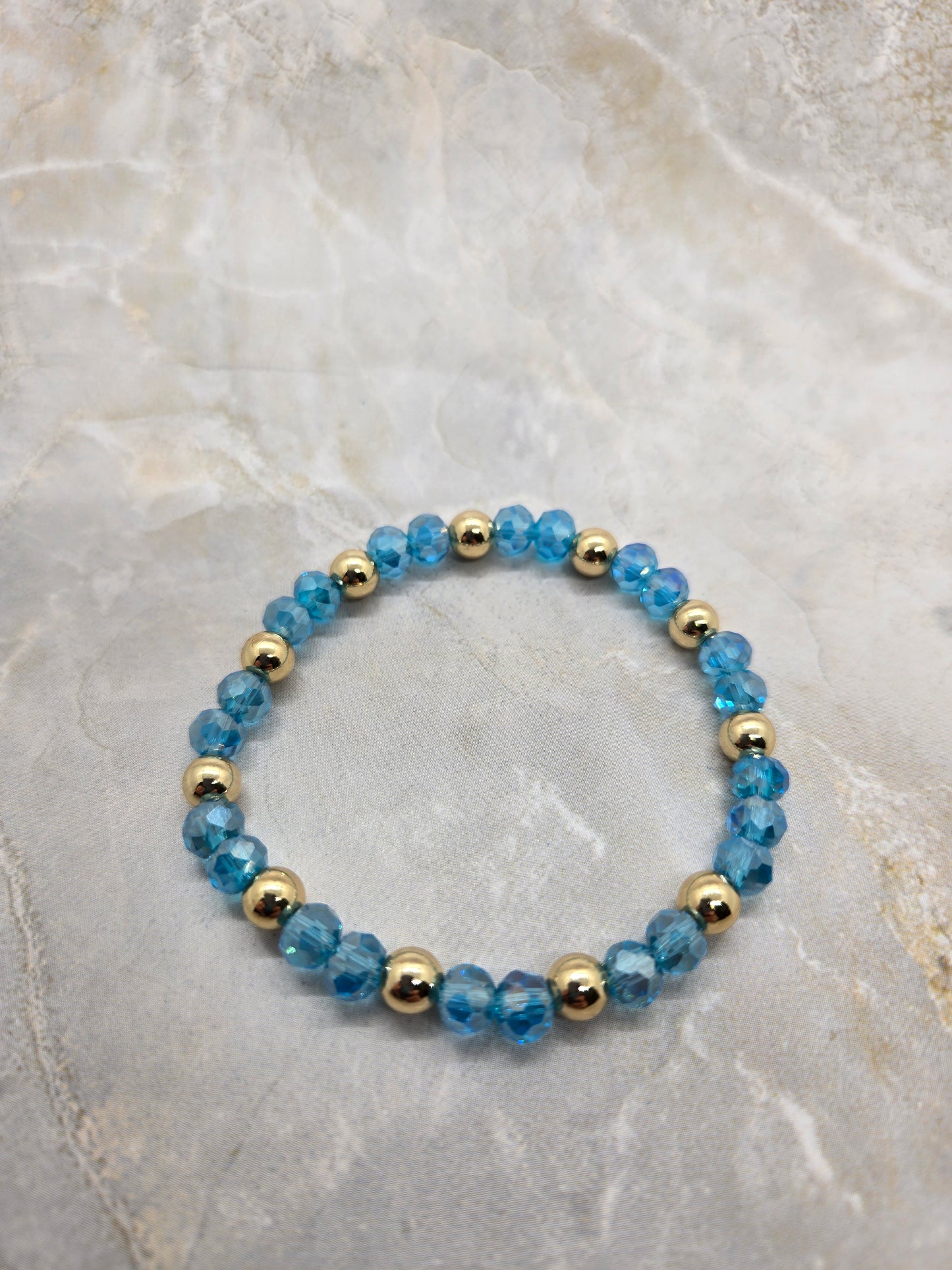Blue and gold plated elastic bracelet