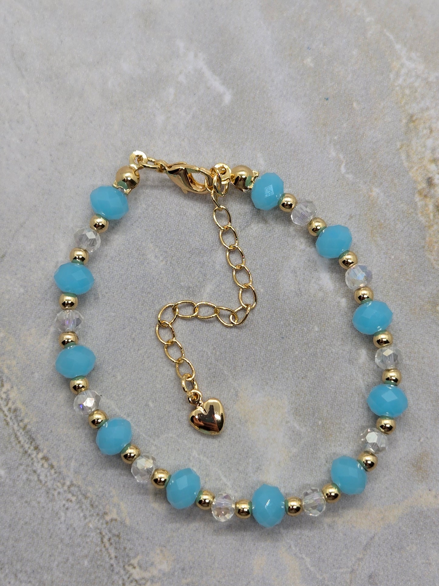 Light blue and gold plated beads bracelet