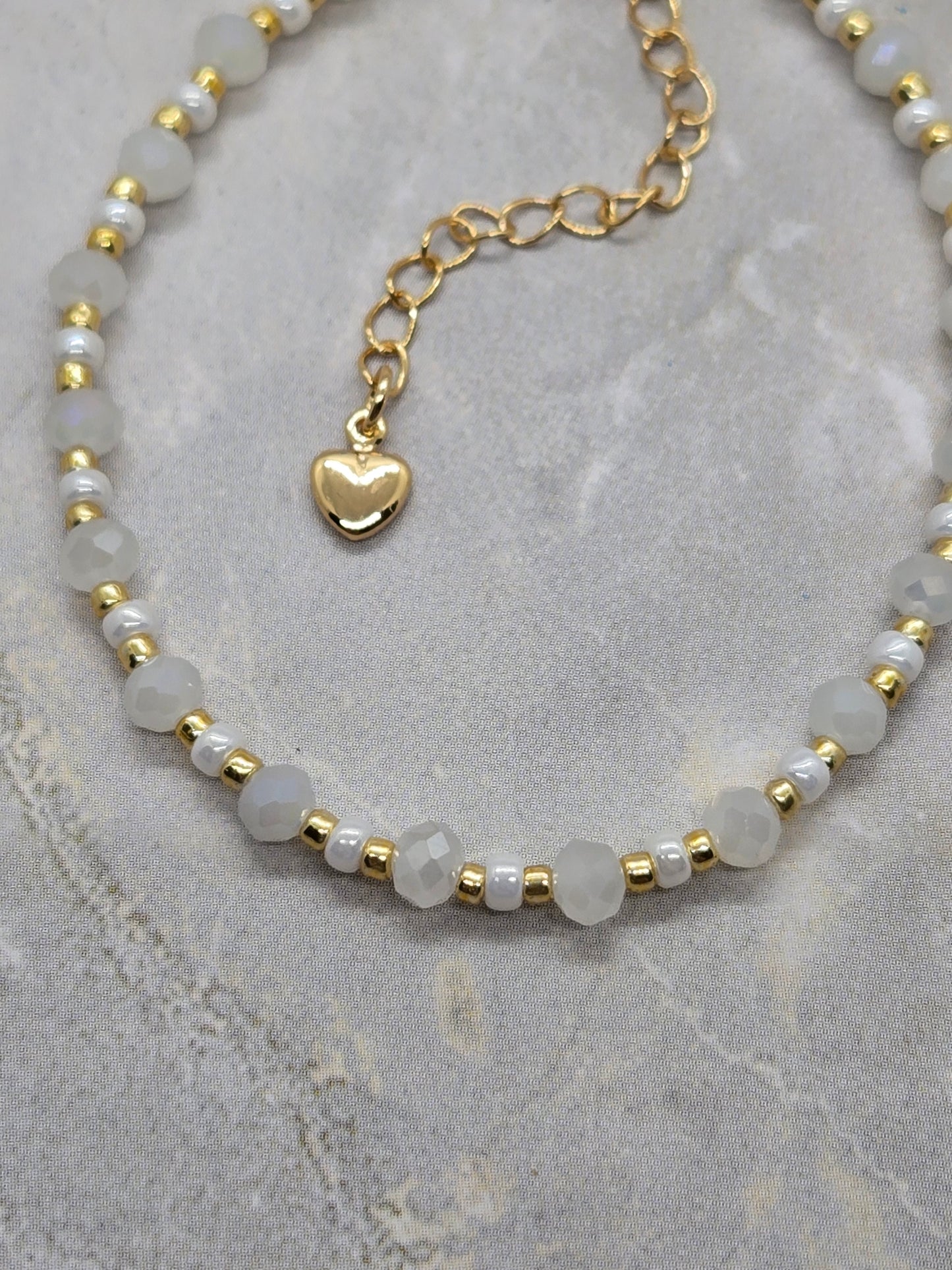 White and gold plated beads bracelet