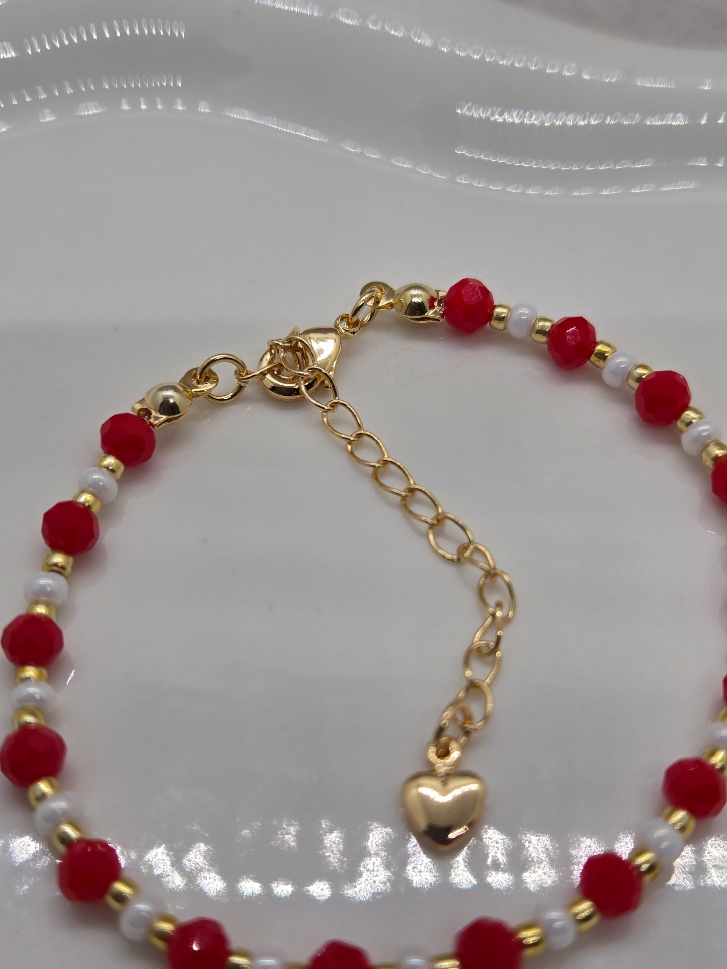 Red, white  and gold plated beads bracelet