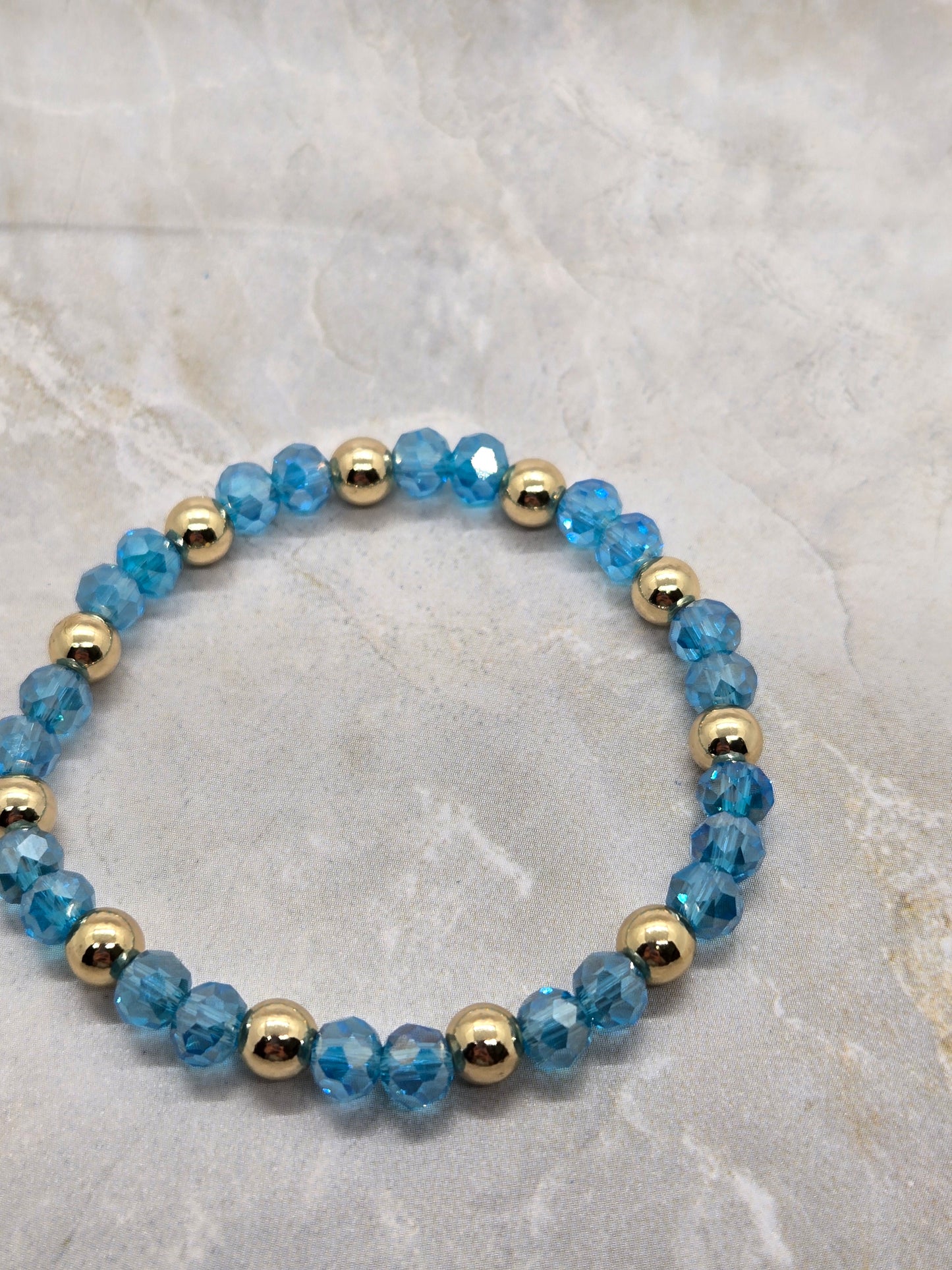 Blue and gold plated elastic bracelet