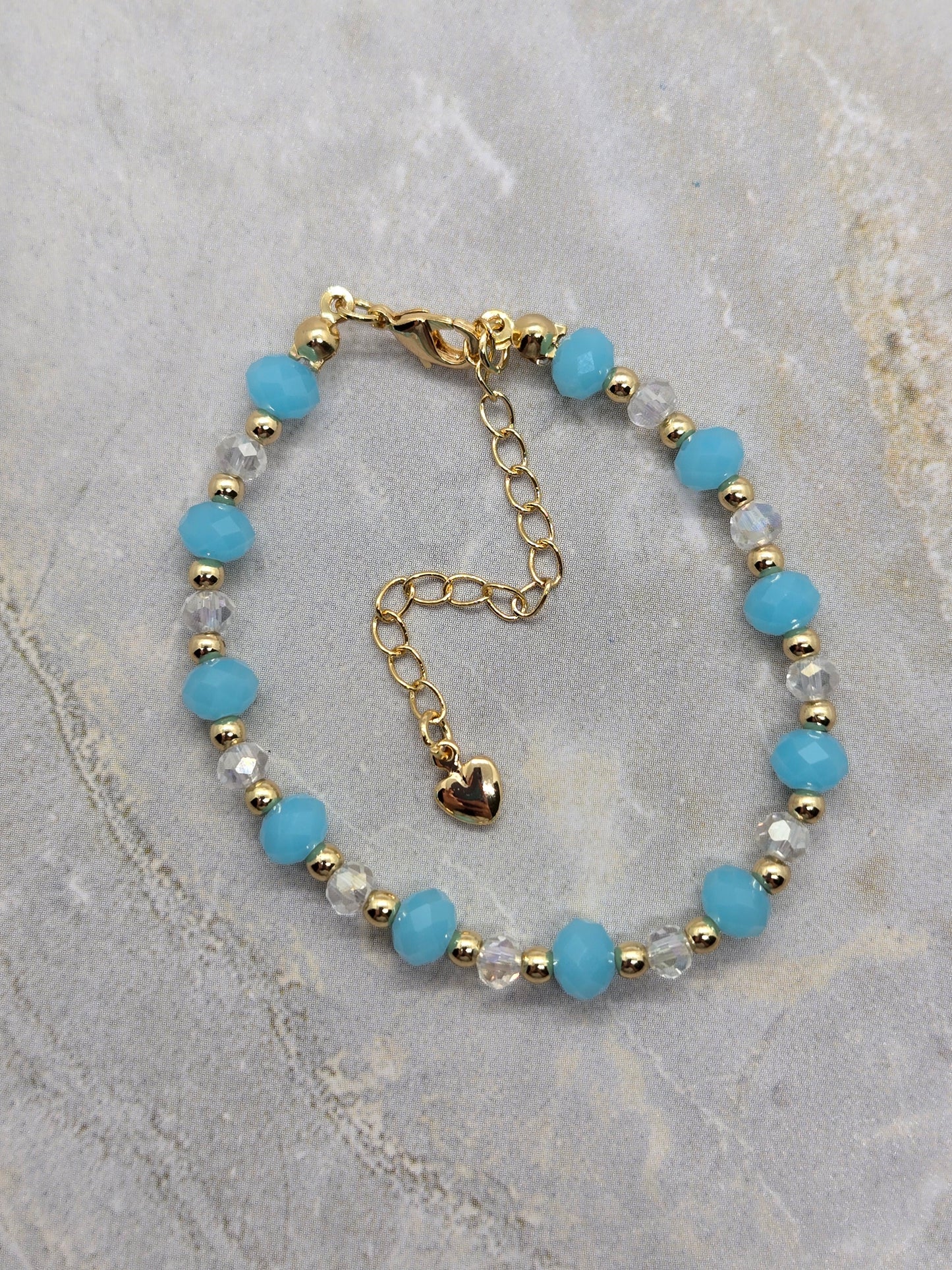 Light blue and gold plated beads bracelet