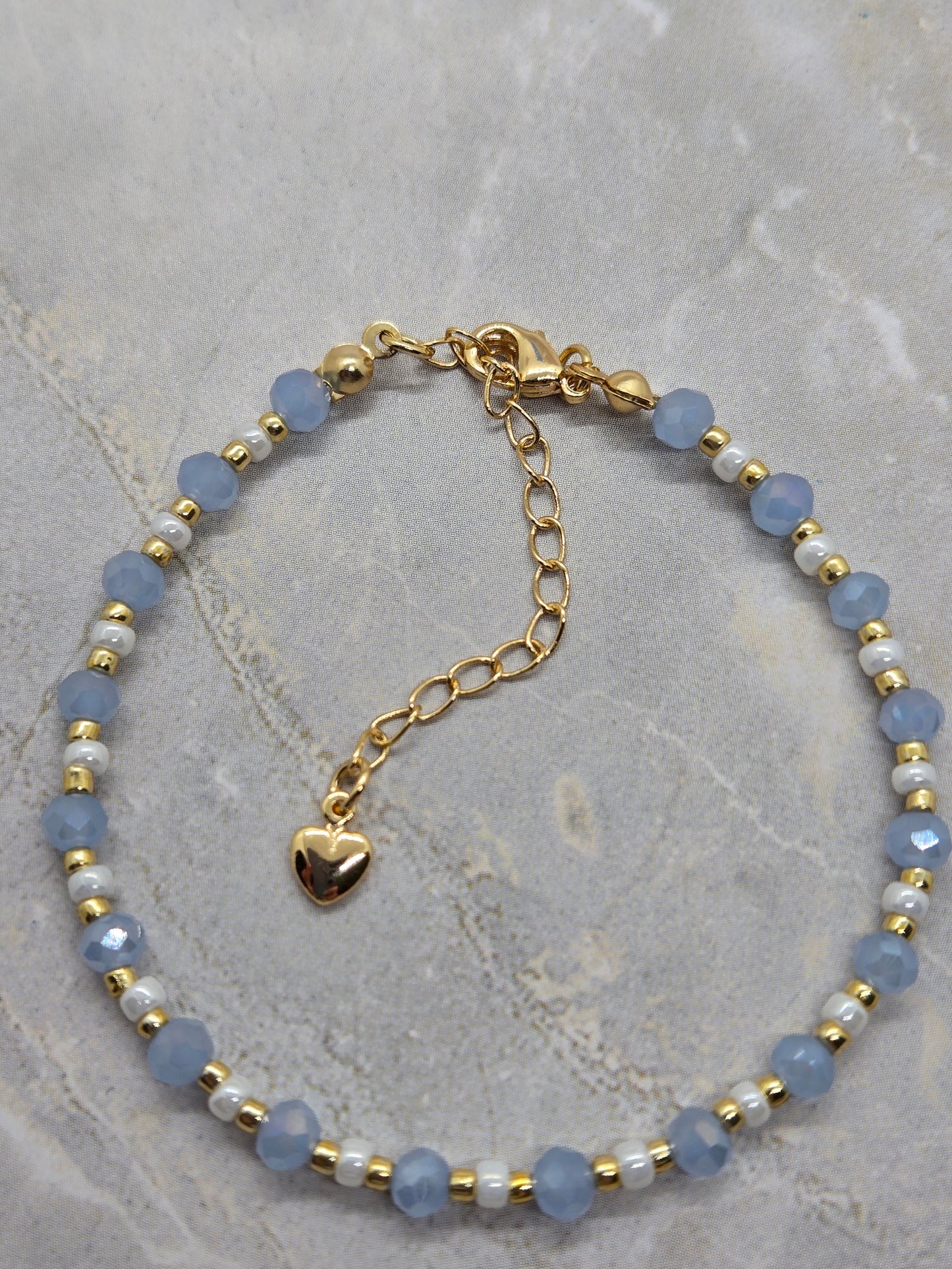 Light blue, white  and gold plated beads bracelet