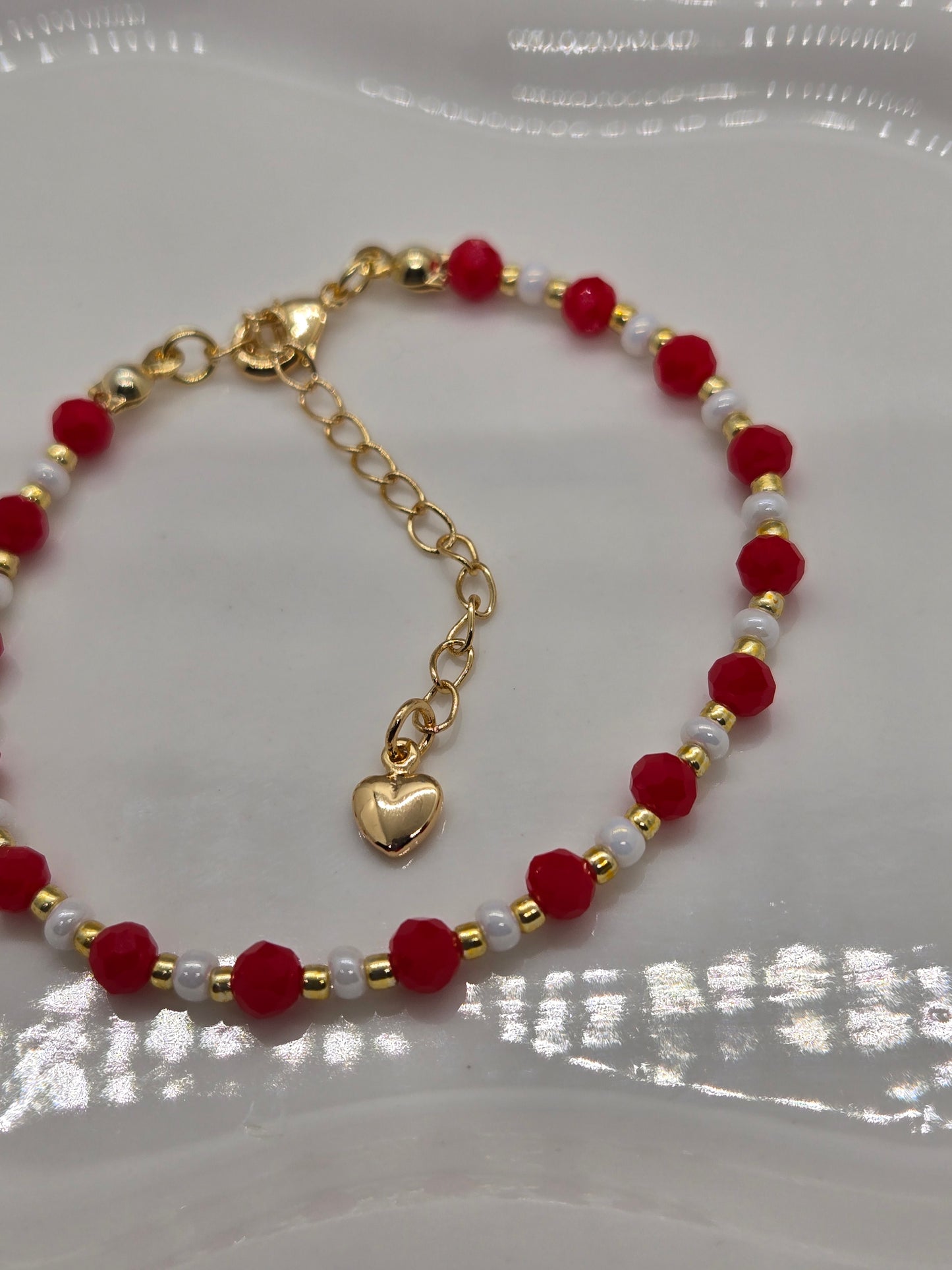 Red, white  and gold plated beads bracelet