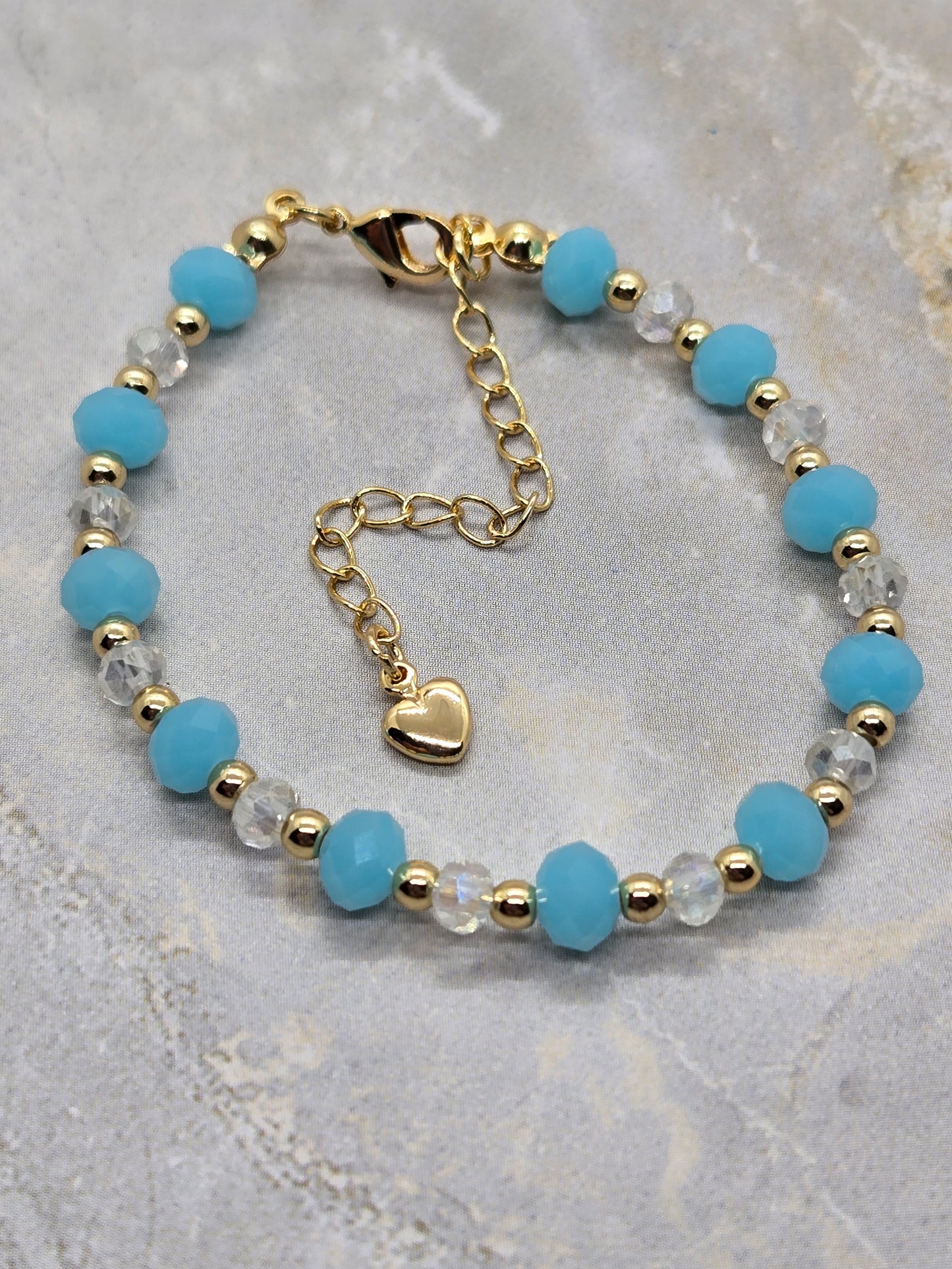 Light blue and gold plated beads bracelet